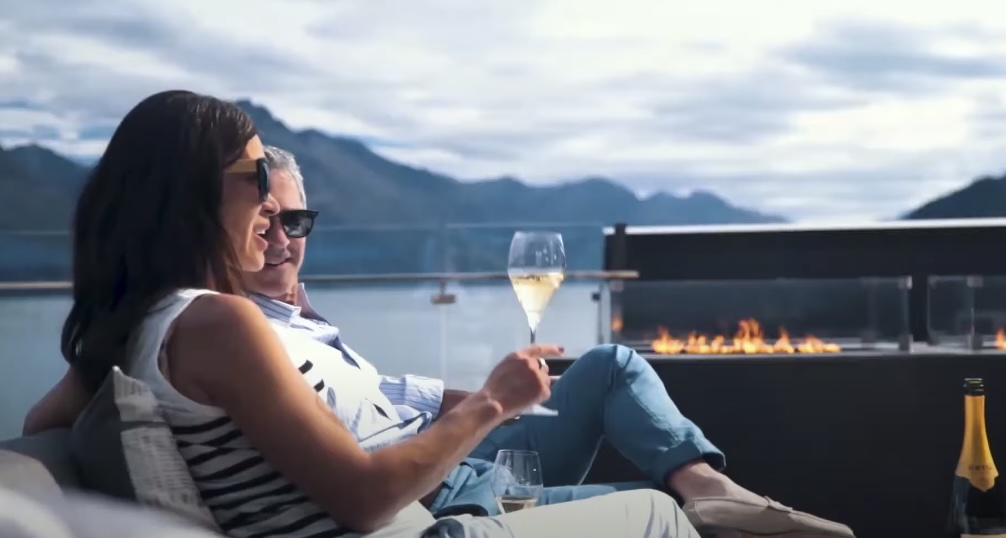 Two People Enjoying Wine Outdoors