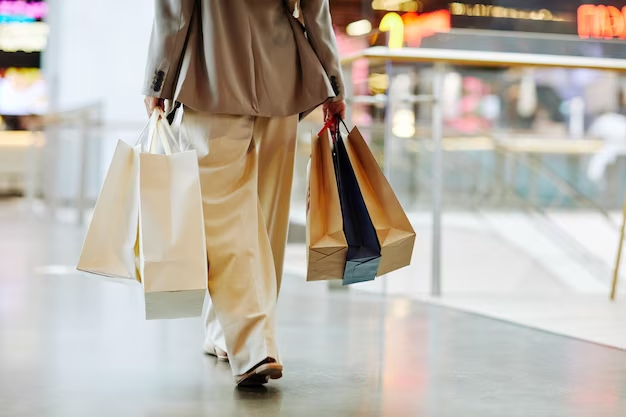 Person Walking with Shopping Bags